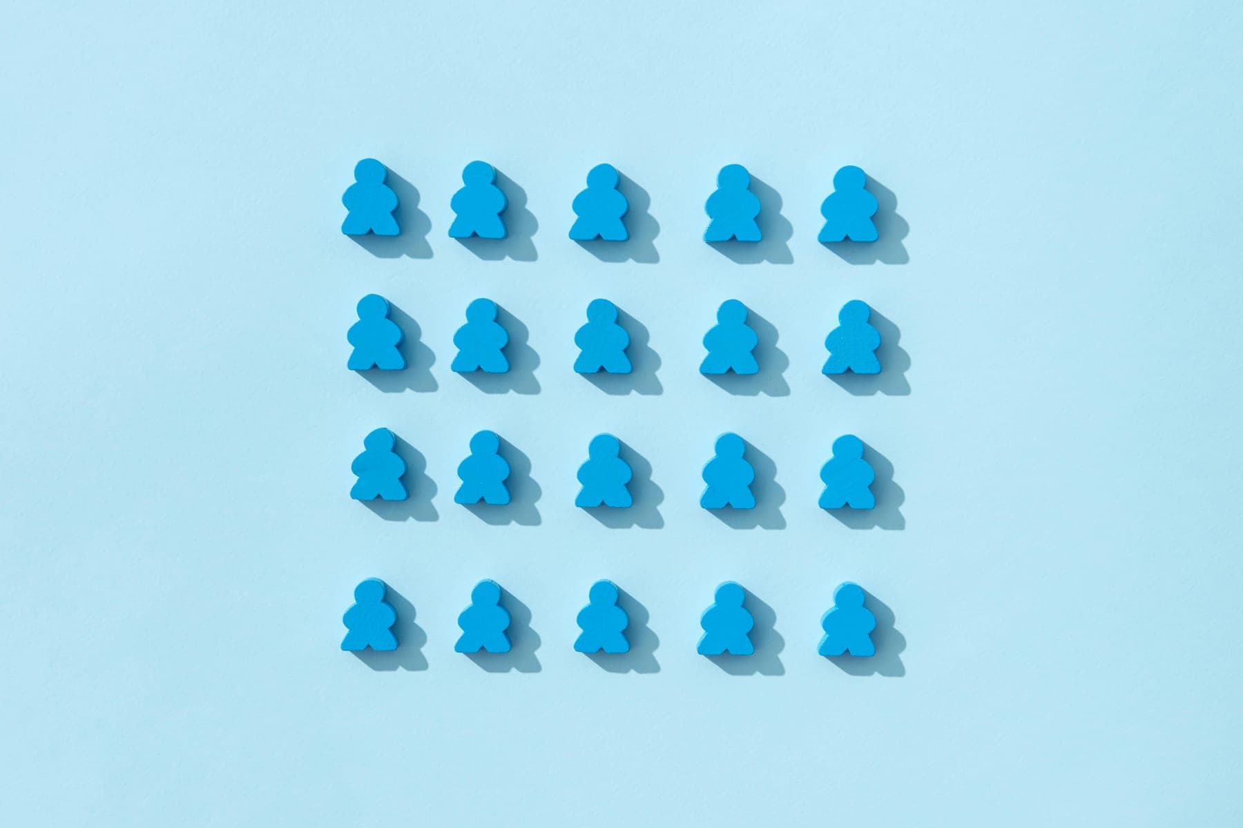 Rows of identical blue figures — everyone moving in the same direction